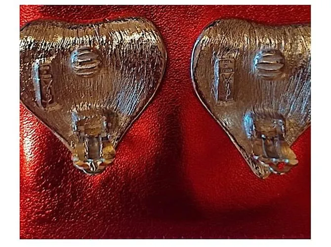 Yves Saint Laurent Hojas de Robert Goosens Dorado 
